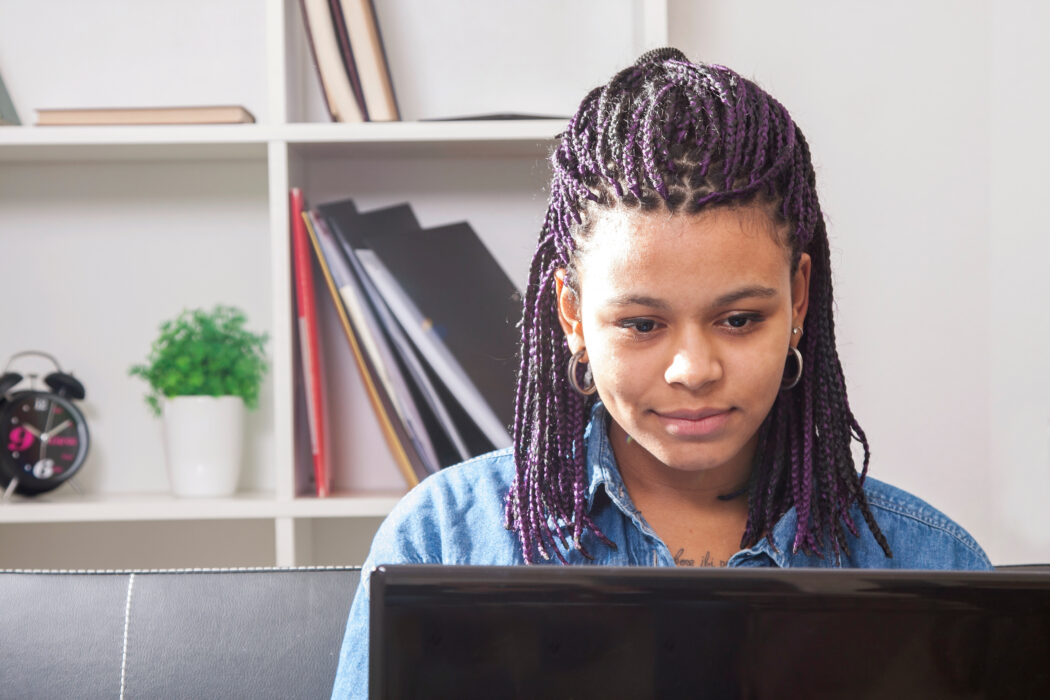 Young woman studies on computer